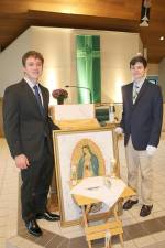 Deputy Chief Squire Joe Pauls and Chief Squire Charlie Wyckoff stand proudly on the altar area which displayed the Silver Rose and the painting of Our Lady of Guadalupe. (Photo provided)