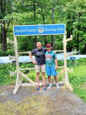 ES1 Mike Crane, left, of Crane Carving with Andrew Wilson, who built a rack to store oars for the Sussex County Rowing Club as his Eagle Scout project. (Photo provided)