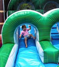 Aulora Massari on an inflatable slide at Sparta Day 2024 on Saturday, June 8. (Photo by Nancy Madacsi)