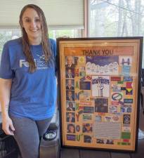 Jessica O’Brien, mask-maker extraordinaire, with some of the thank-you’s she’s received for her hard work.