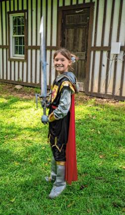 Gwen Gibbons poses with a sword.