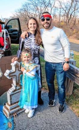 Lisa and Matt Coppola with Vienna, dressed as Cleopatra.