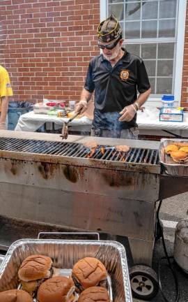 Rudy Beckmann prepares burgers at the lunch hosted by Veterans of Foreign Wars Post #7248.