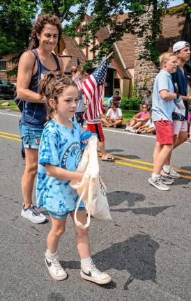 Members of the Lake Mohawk Pool swim team march in the parade.