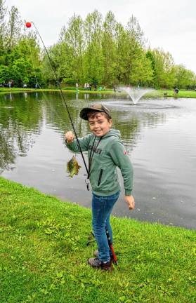 Logan Bryan with a fish on his line.