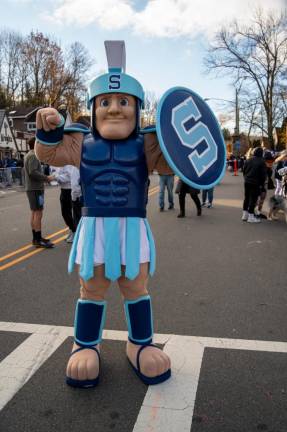 The Sparta Spartan cheers on the runners.