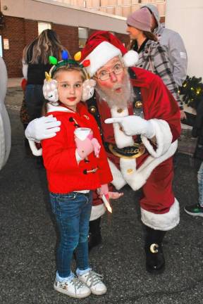 Olivia Kopala of Newton poses with Santa.