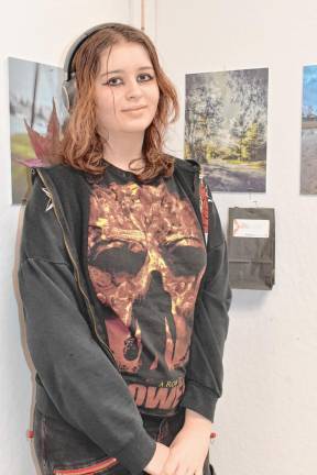 Daria Radkova stands by her photo on display. (Photo by Maria Kovic)