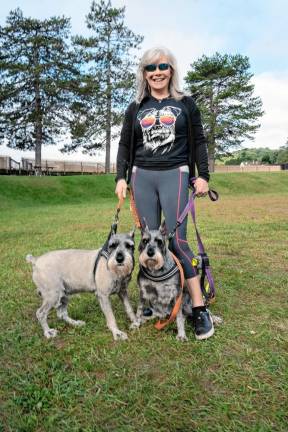 Shelley Devine with Chase and Tassie, which are Schnauzers.