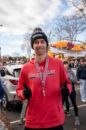 5K winner Jason Gibbons with his medal.