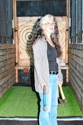 <b>Jen Cerra of Frankford with axes for throwing.</b>