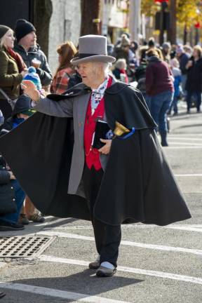 William Joseph, the Sussex County town crier, makes his way down the street before the parade starts.