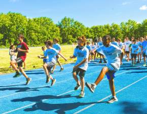 Participants in the Sparta Track and Field Camp work on their skills. (Photo by Maria Kovic)