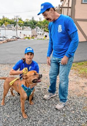 Debbie Nash and Ken Waldian of Father John’s Animal House with Mornhineway, who is waiting for adoption.