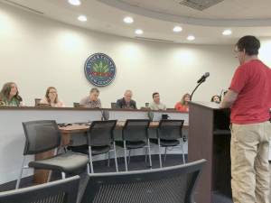 County employee Steven Masnaghetti, right, speaks at the Sussex County Commissioners meeting Dec. 14 in Newton.