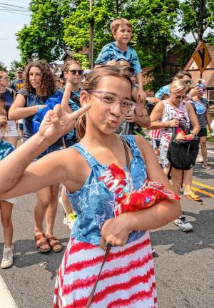 A Lake Mohawk Pool swim team member marches in the parade.