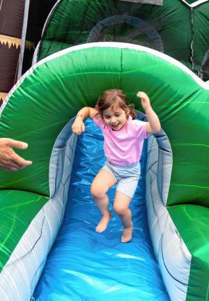 Aulora Massari on an inflatable slide. (Photo by Nancy Madacsi)