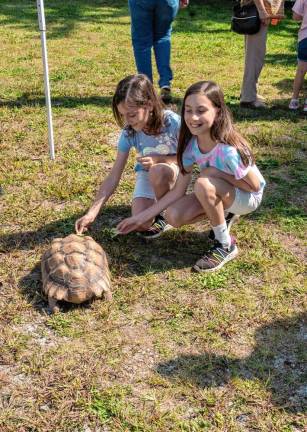 SCH4 Nilla and Dax Wolf feed Sadie the Turtle.