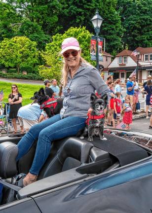 A Lake Mohawk trustee and her dogs ride in the parade.