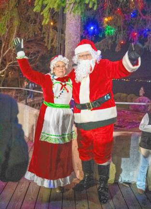 Santa and Mrs. Claus wave to the crowd.