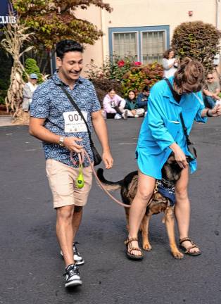 DS5 Aaron Shrensel walks Rona, a German Shepherd, who was rescued.