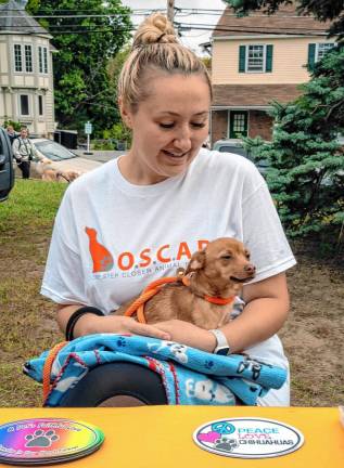 BS3 Cassie Kowalchuk, president of One Step Closer Animal Rescue (OSCAR), holds Lily Rose, who is up for adoption.