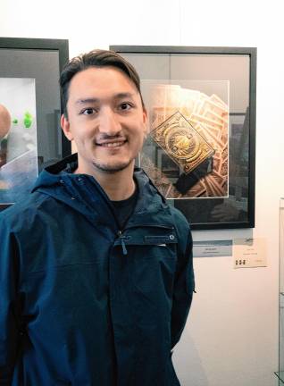 Sam Cheung with his photo ‘007,’ which won the Still Life Award.