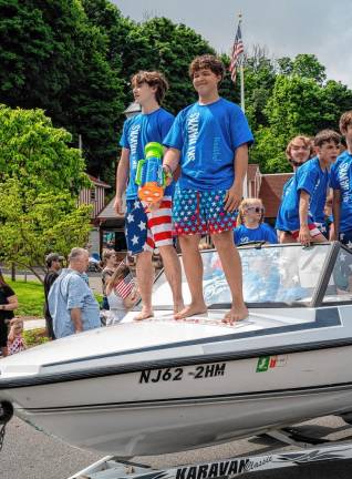 Members of the Ski Hawks competitive water-skiing team ride in the parade.