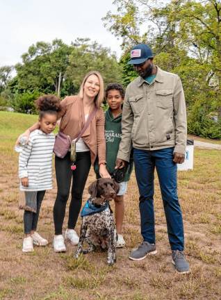 The Desmond Castello family with Rossi, a German shorthair pointer.