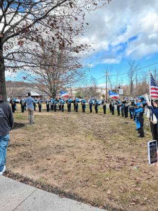 The Sparta High School band plays the National Anthem and a medley of the songs of all branches of the U.S. armed forces.