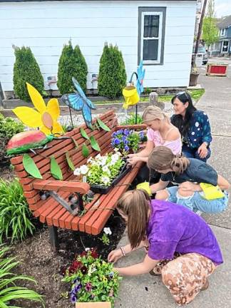 <b>Tessa Cope, Kelsey Birchenough, Emily Morgan and Sue-Ni DeStefano work on the Selfie Benches Project in Branchville.</b>