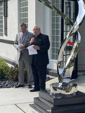 The Rev. Msgr. Kieran McHugh says a prayer during the opening ceremony.