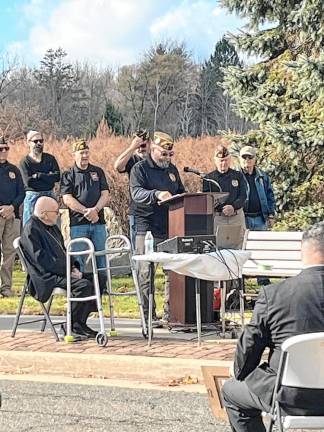 Pete Litchfield, commander of Veterans of Foreign Wars Post 7248, speaks at the ceremony in front of the post.