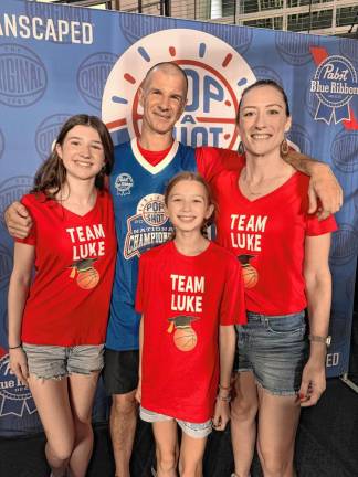 PS1 Luke Kachersky of Sparta enjoys playing the Pop-A-Shot arcade basketball game with his wife, Katie Tracy, and daughters, Ellie, 16, and Hana, 11. (Photos provided)