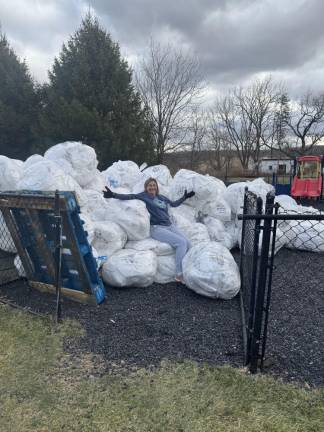 Nelly Maccaro of the Sparta Community Food Pantry with a load of reusable bags on the way to the recycler, Goatote in Hackettstown.