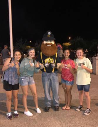 Kate King, right, now a senior at High Point Regional High School, attends a Sussex County Miners game with her friends when they were younger. (Photo provided)