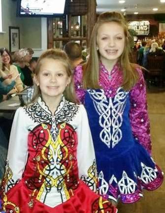 Sisters Mara (left) and Aylia (right) Mahon enter the Irish Dancing event held at The Irish Cottage last week. The girls hail from Stillwater and have been at the Byram An Clar School for a number of years.