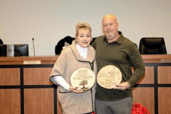 Township Council members Christine Quinn and Josh Hertzberg are honored for their service during the Dec. 10 meeting. (Photos by Dave Smith)