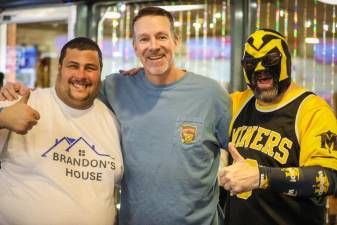 From left are Brandon Bordt, Sussex County Miners manager Chris Widger and Miner Man. The Miners hosted an event Jan. 23 at Sparta Lanes to raise money to help pay for a new home for Bordt and his father, Jim. Brandon is known as the Miners’ No. 1 fan. (Photos by Jay Vogel)