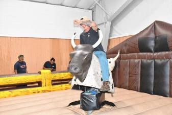 <b>Charles Marone of Byram rides a mechanical bull at Sussex County Day on Sunday, Sept. 15 at the Sussex County Fairgrounds. (Photos by Maria Kovic)</b>