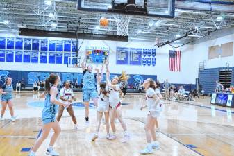 Sparta's Molly Chapman (34) tosses the ball toward the hoop in the game Feb. 26 against Northern Highlands. The Spartans won, 49-42, to advance to the quarterfinal round of the NJSIAA North Jersey, Section 1, Group 3 tournament. (Photos by George Leroy Hunter)