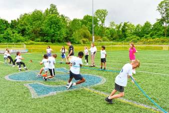 Students compete in a tug of war during the annual L.E.A.D. Day on June 6 at Station Park. (Photos by Maria Kovic)