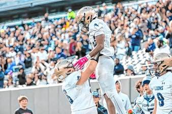 Tylik Hill is lifted up after he makes a touchdown against DePaul in the NJSIAA Non-Public, Group B championship game Nov. 29. (Photos by Glenn Clark)