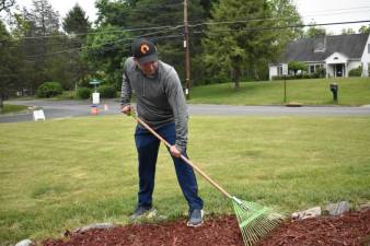 Matt Hamann of Sparta spreads mulch at Katie’s House in Stillwater. (Photos by Laurie Gordon)