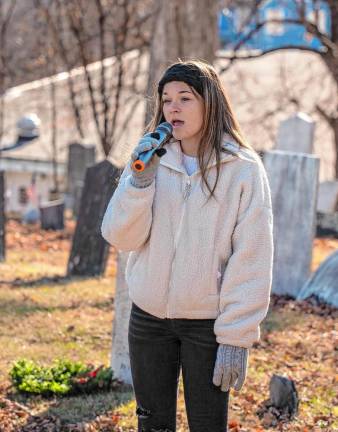 Katie Williver sings the National Anthem during the Wreaths Across America ceremony Saturday, Dec. 14 at the Old Newton Burial Ground. (Photo by Nancy Madacsi)