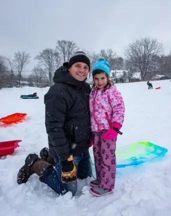 Aaron Sibenac of Warwick and his daughter Romy Sibenac, 4, joined in on the fun in January 2024. Romy’s snow gear included her pair of stylish, hot pink gloves and a blue/green marbled toboggan sled. Photo by Aja Brandt.