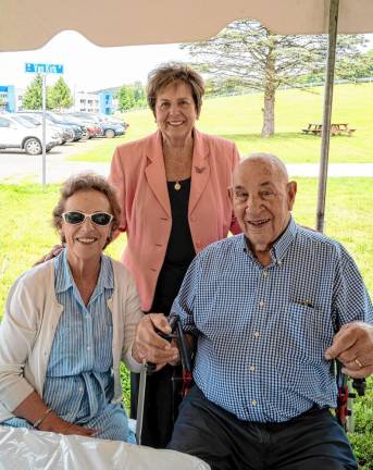 Christine and Ed Fritsch with Marjorie Strohsahl, standing, at her 80th birthday party at the Van Kirk Homestead Museum in Sparta. Strohsahl is a co-founder of the Sparta Historical Society, and t.he Fritsches are founding members.