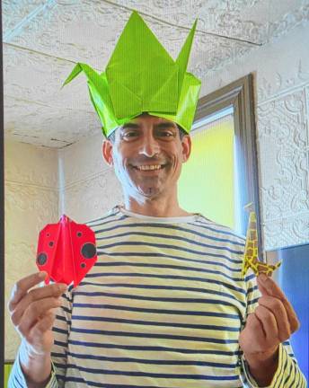 <b>Carlo D’Ambrosi with examples of his origami. (Photos provided)</b>