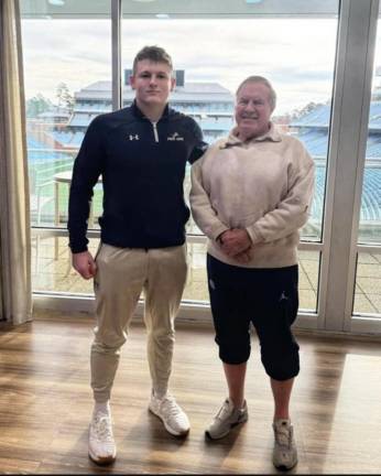 Pope John XXIII Regional High School senior Tyler Houser poses with University of North Carolina head football coach Bill Belichick.