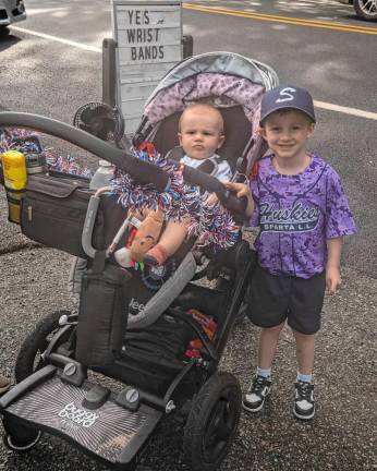 Leo and Asher McCarney wait for the parade to begin.